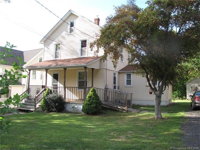 Welcoming front porch with ramp, newer siding and 