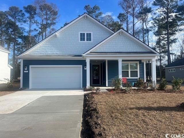View of front of home featuring a garage