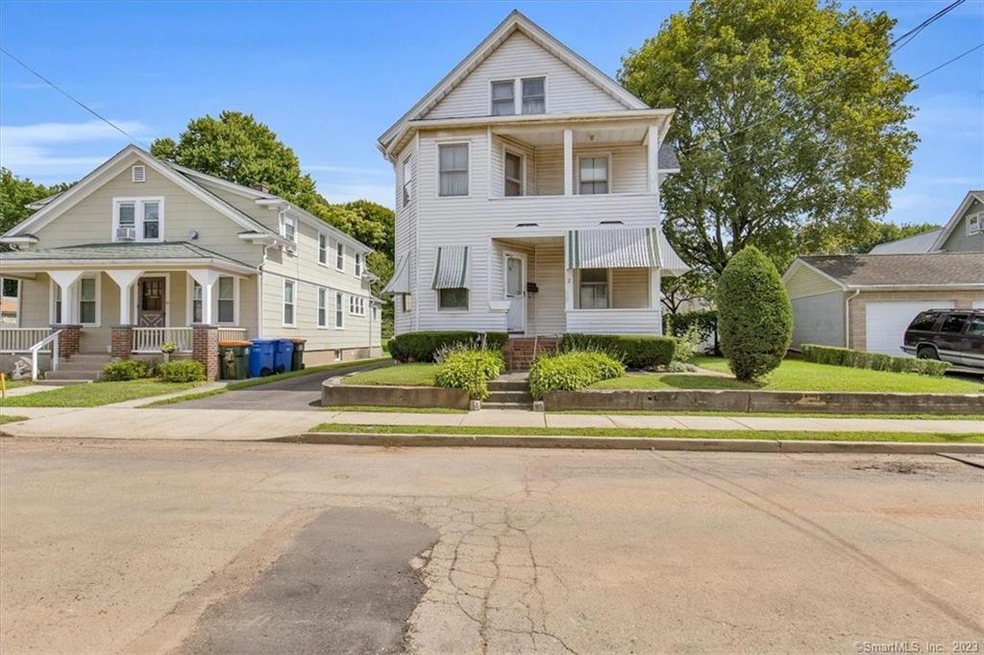 As you arrive at this delightful 2-family you can'