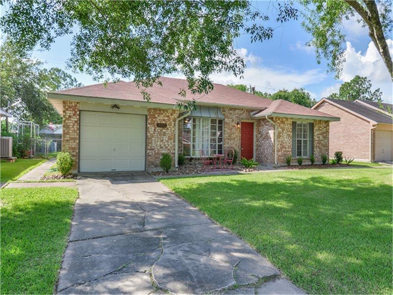 Beautifully remodeled, the home enjoys incredible shade from the mature tree out front.