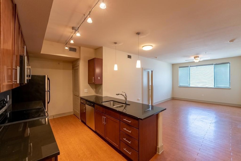Kitchen featuring a peninsula, visible vents, bro