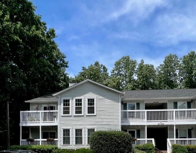 Front view of property with a balcony
