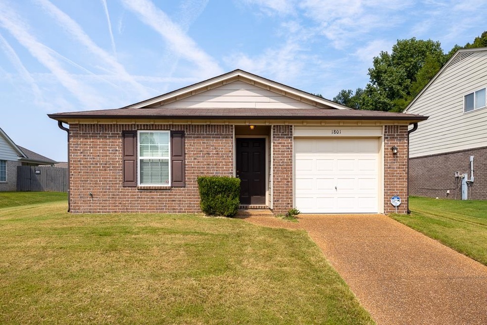 View of front of property with a garage and a fron