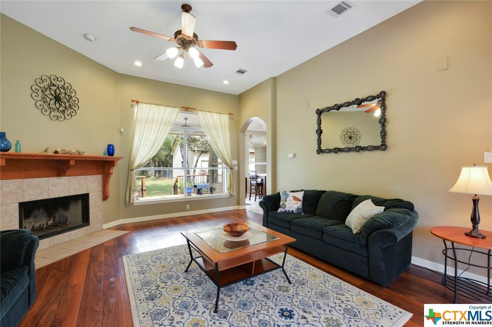 Large windows are found throughout the home providing breathtaking views to the abundant landscaping around the property.