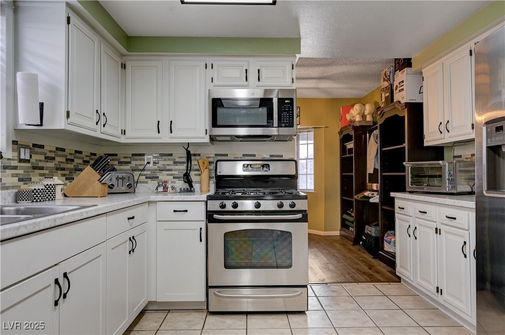 Kitchen with appliances with stainless steel finis