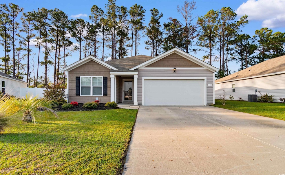 View of front of house with driveway, fence, a fro