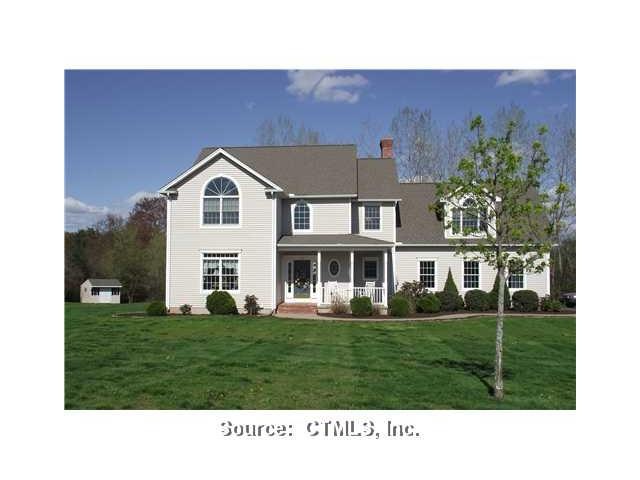 Exterior Front. Professionally landscaped lawn on 