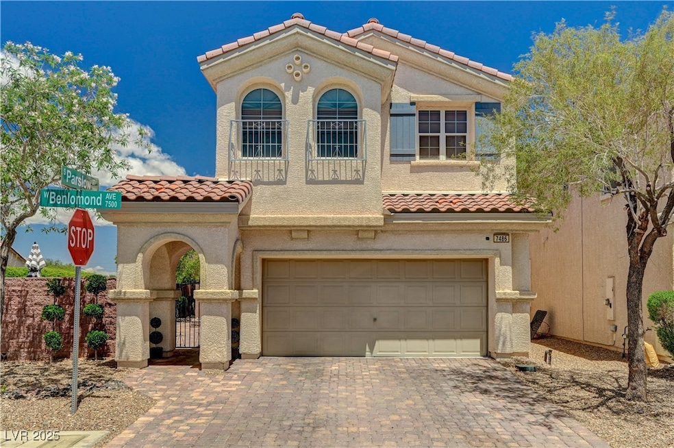 Mediterranean / spanish home featuring a tile roof