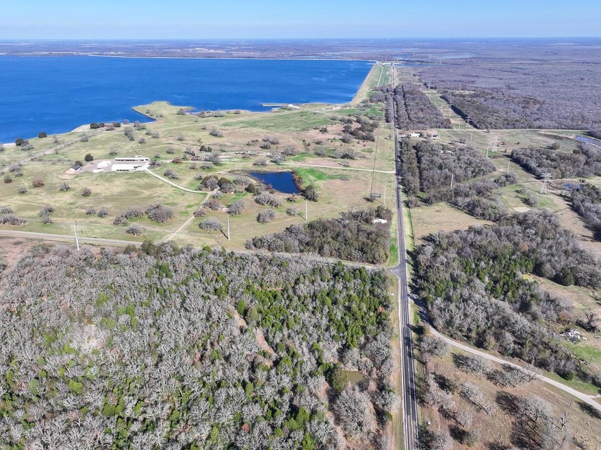 Drone / aerial view with a rural view and a water 