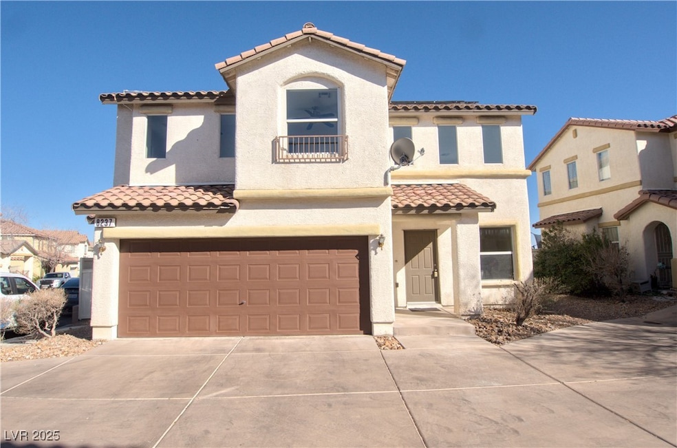 Mediterranean / spanish house with a garage, a til