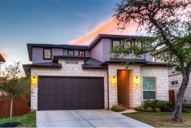 Stunning curb appeal! White limestone, beautiful l