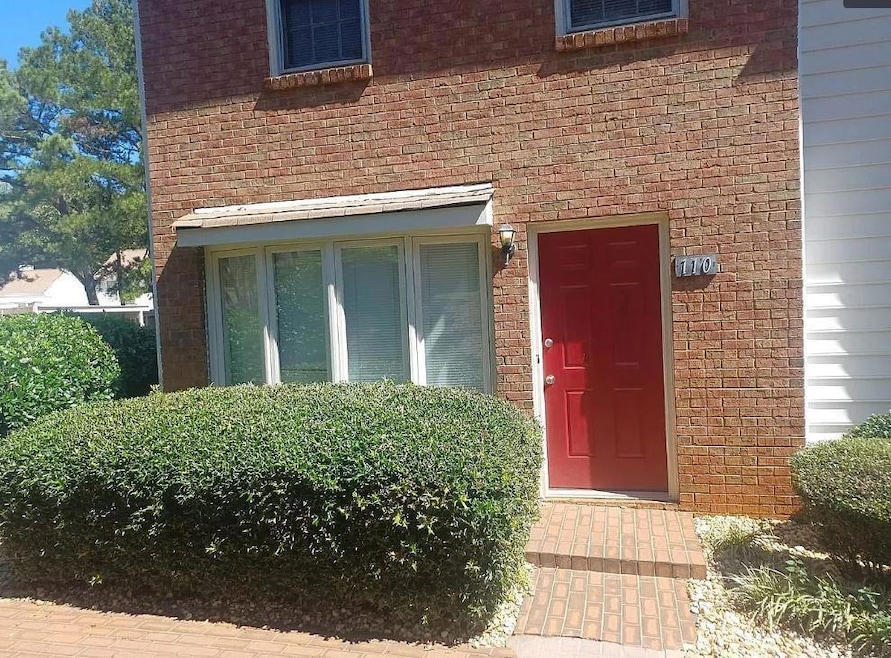 Property entrance with brick siding