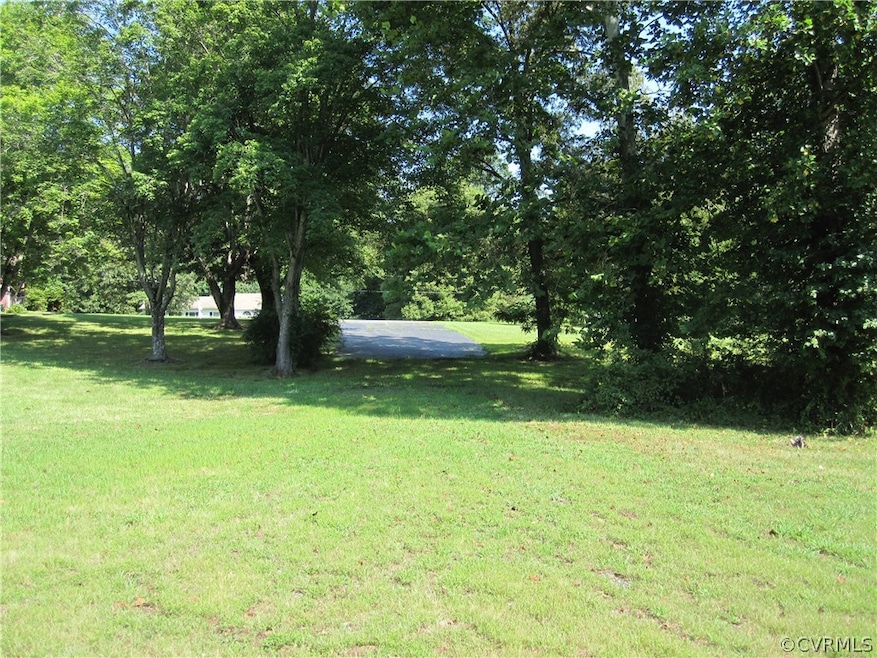 Right half of driveway & into the grass is the roa