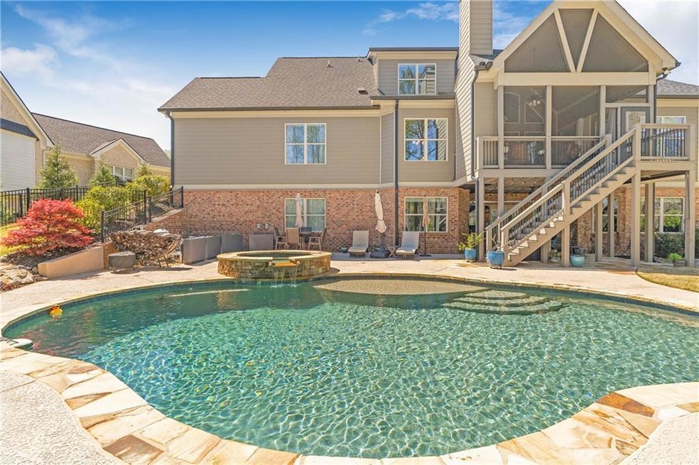 View of pool featuring a patio, an in ground hot t