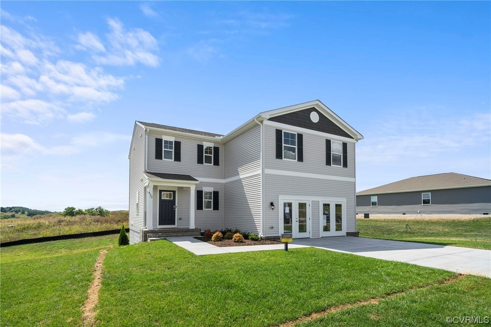 Front facade featuring a front yard and french doo