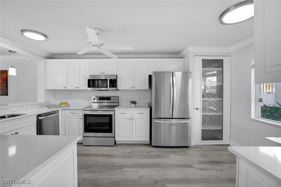 Spacious kitchen featuring appliances with stainle