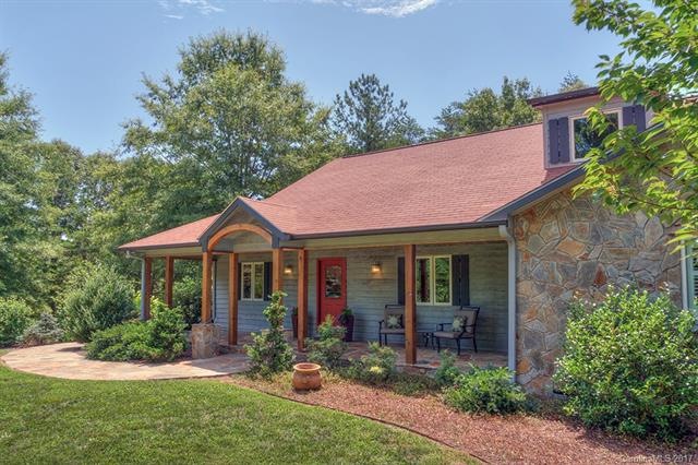 Flagstone walkway leads to the airy front porch.  