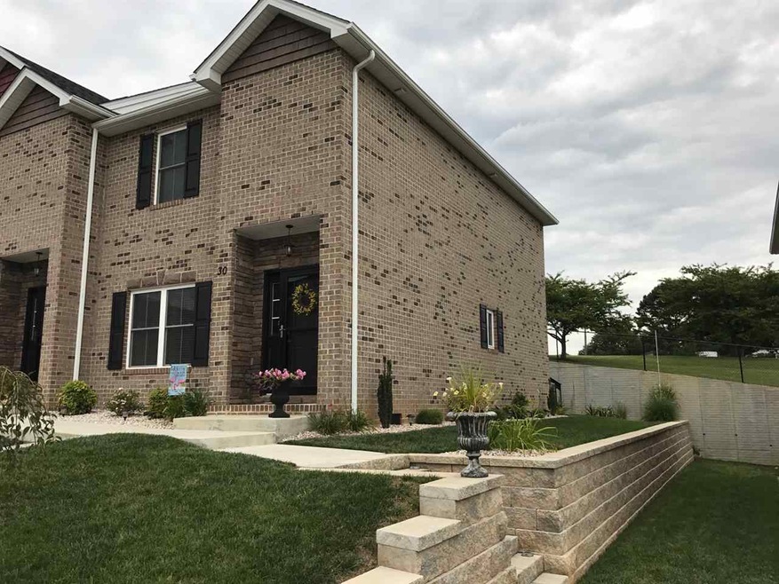 ATTRACTIVE TOWNHOUSES WITH BRICK EXTERIORS AND A L