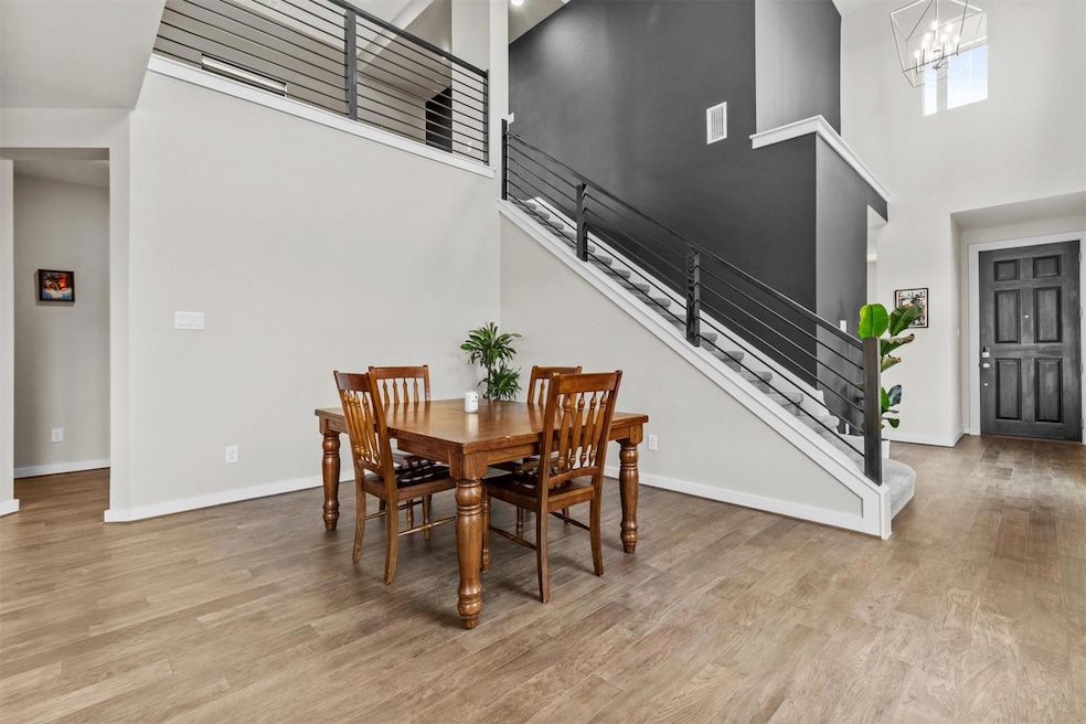 Dining space with a high ceiling, wood finished f