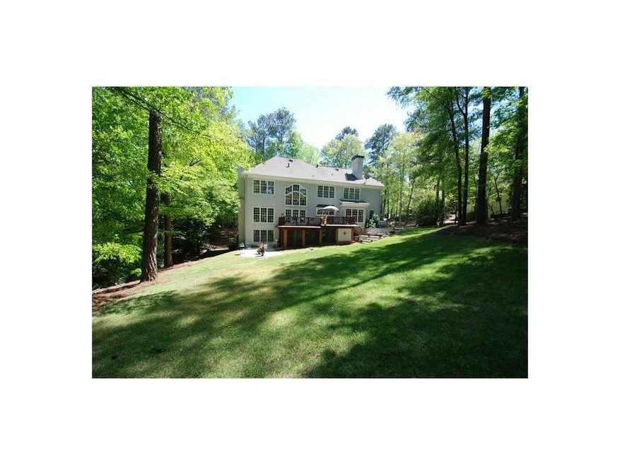 Exterior Back. .7 acre offers a great yard to rest