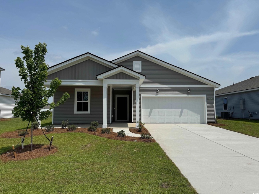 Ranch-style home with an attached garage, driveway, central air condition unit, a front lawn, and covered porch