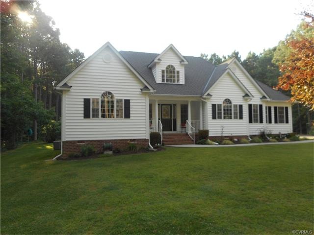 Front view showing front porch and beautiful yard