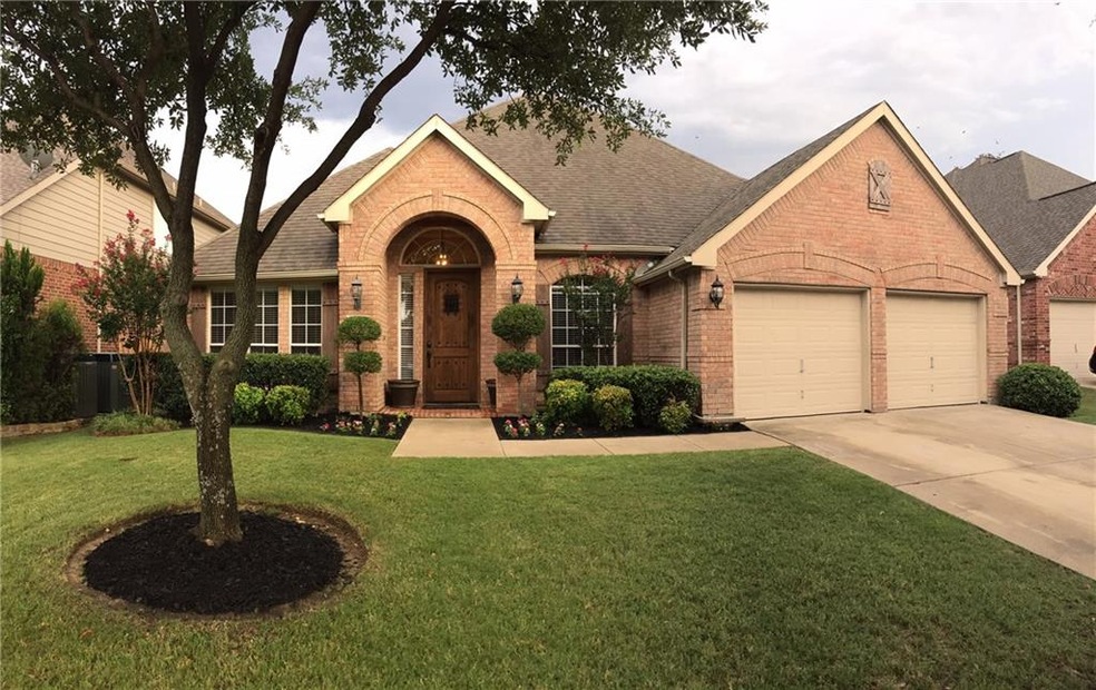 What curb appeal!!!! Beautiful landscaped front ya