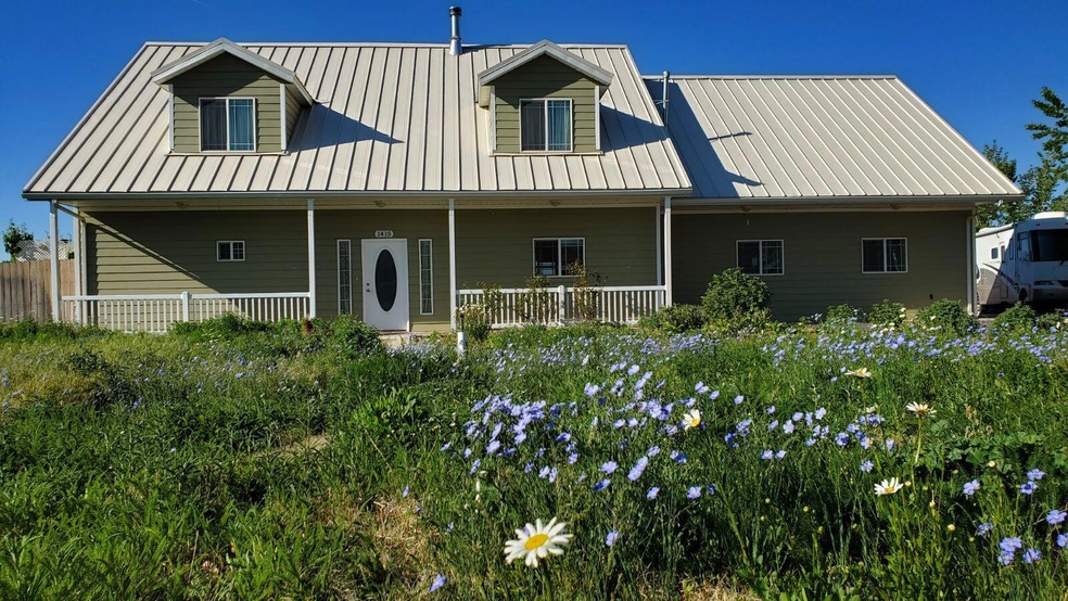 front photo with railings and flower