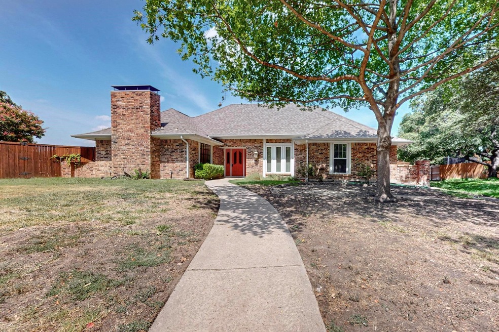 Ranch-style home featuring a front yard