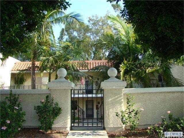 Exterior shot.  Gorgeous palms and mature trees