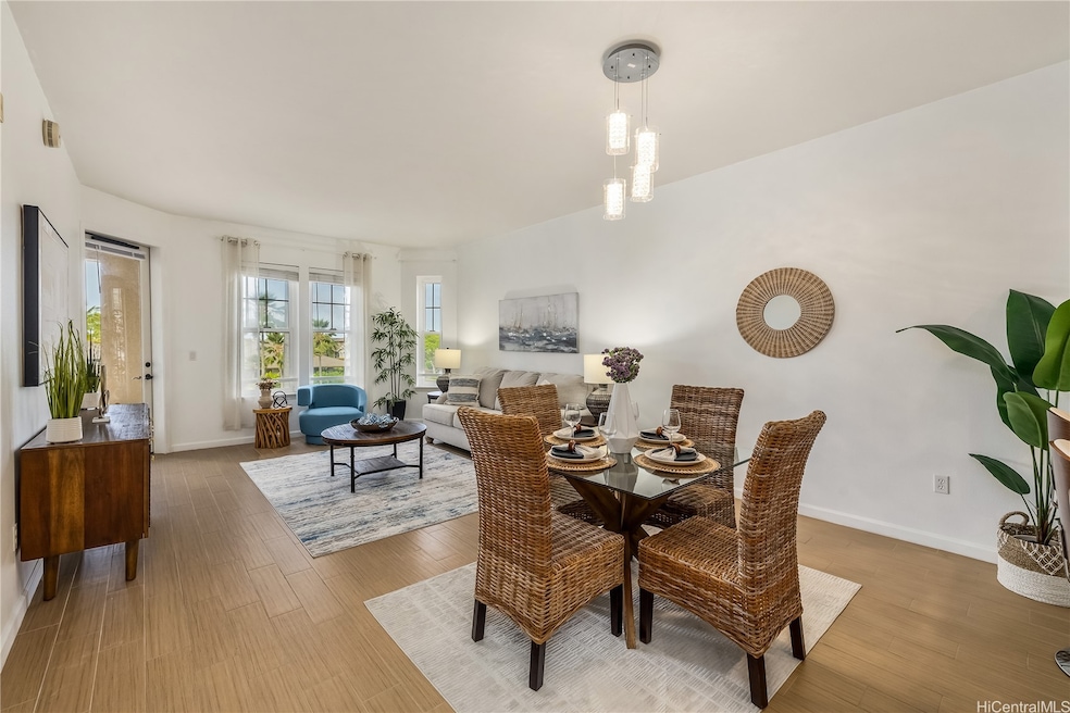The dining and living room with 9' ceilings and wo