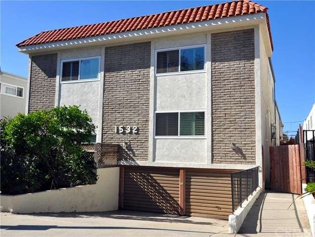 FRONT VIEW/2 CAR GARAGE, RIGHT OF COMPLEX