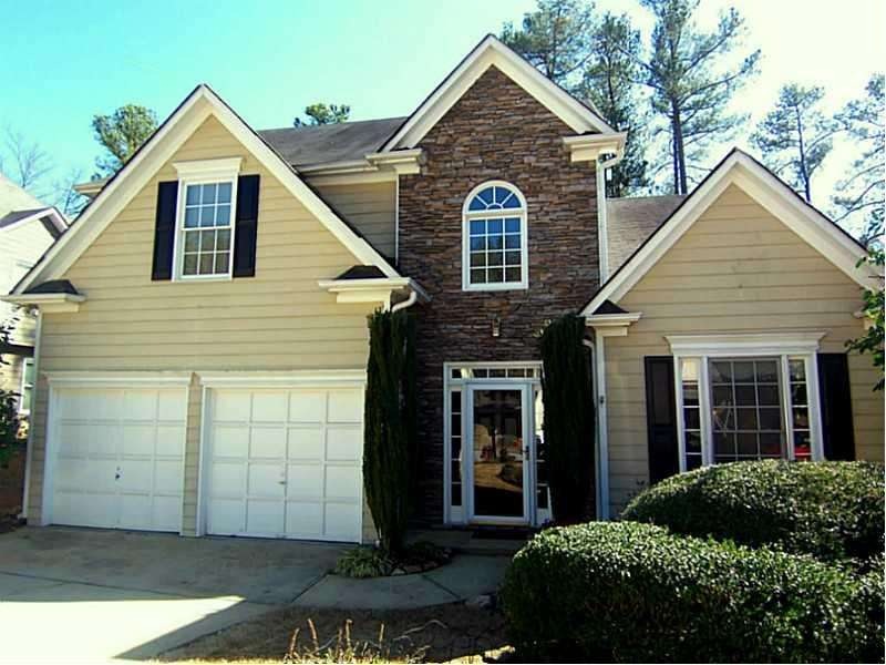 Exterior Front. Stacked stone entryway gives this 