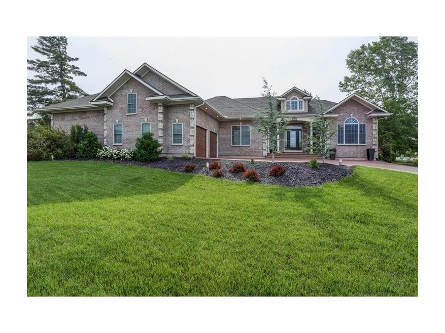 Stunning brick and stone entry with 4 car, side en