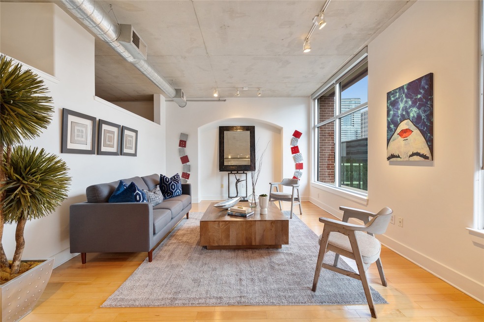 Beautiful spacious family room with exposed concre
