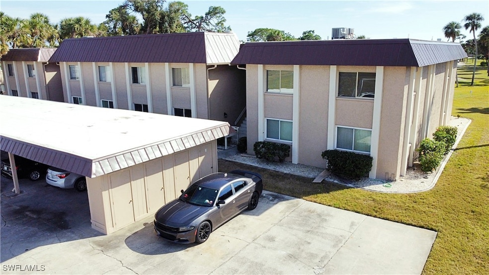 View of front of property with a front yard and ce