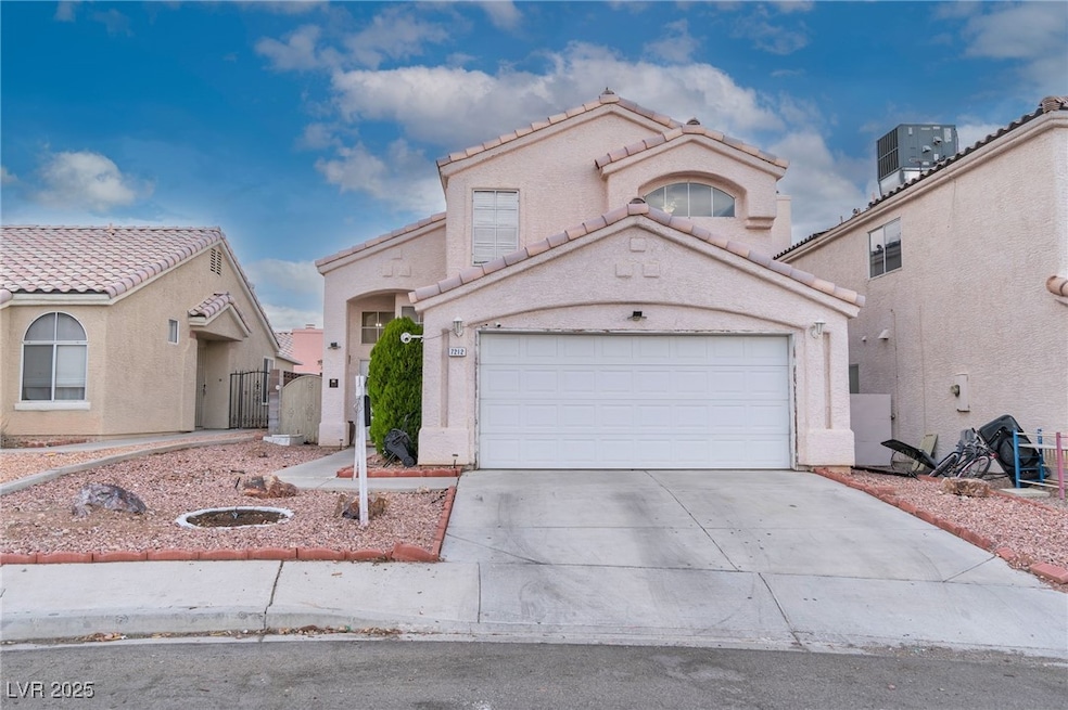 Mediterranean / spanish-style house with a gate, driveway, stucco siding, a garage, and a tile roof