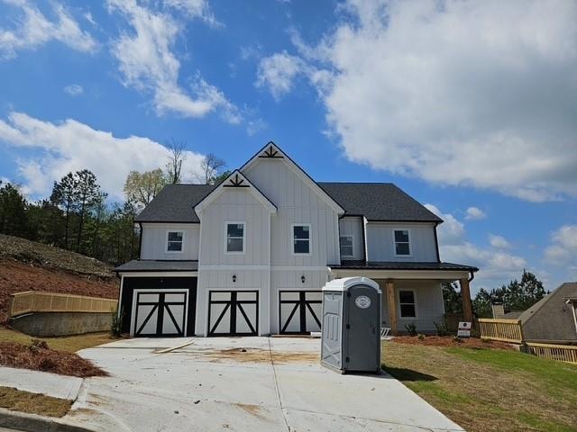 Modern farmhouse style home featuring board and ba