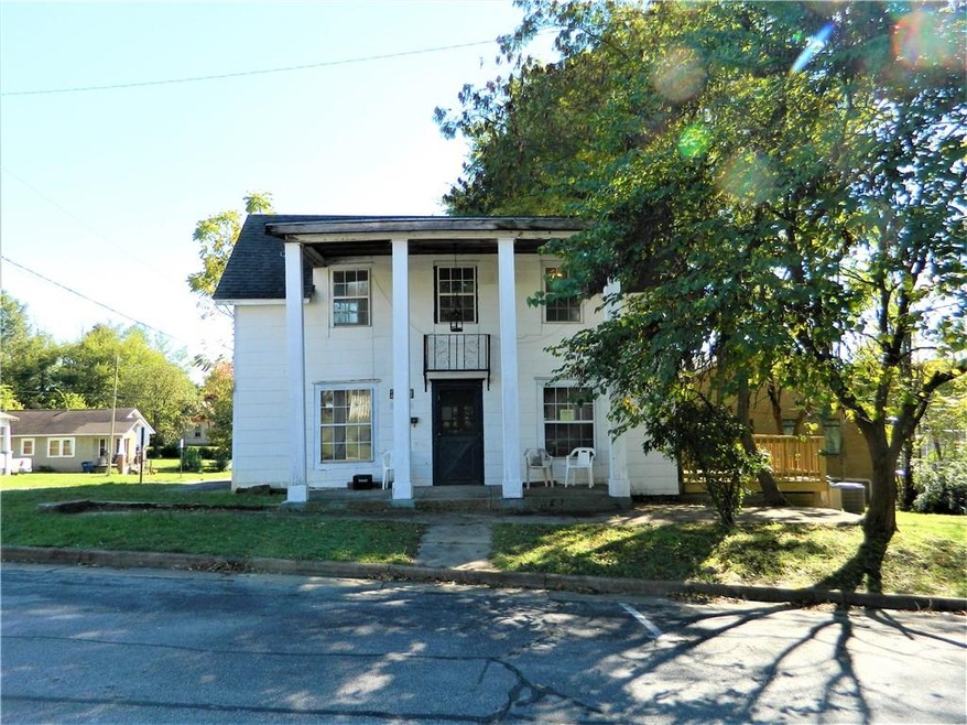 Built in 1897, this grand Georgian style home still has lots of charm to give. Large corner lot with easy access to all of the wonderful things downtown Siloam Springs has to offer.