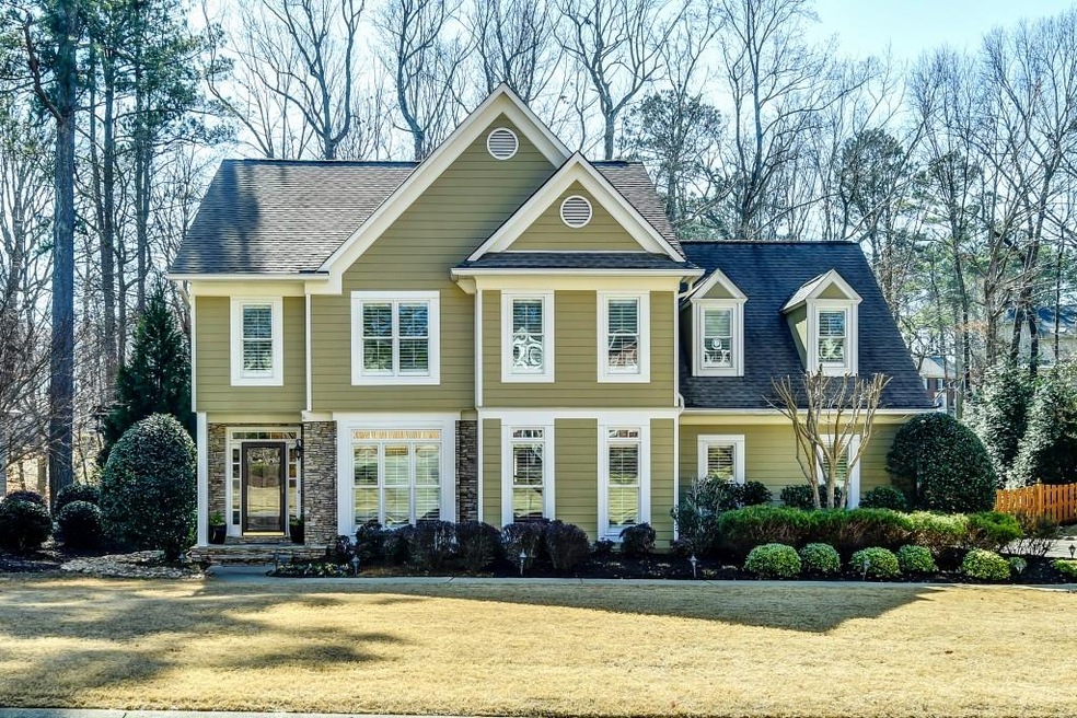 Lovely home on level lot tucked just inside Chatsw