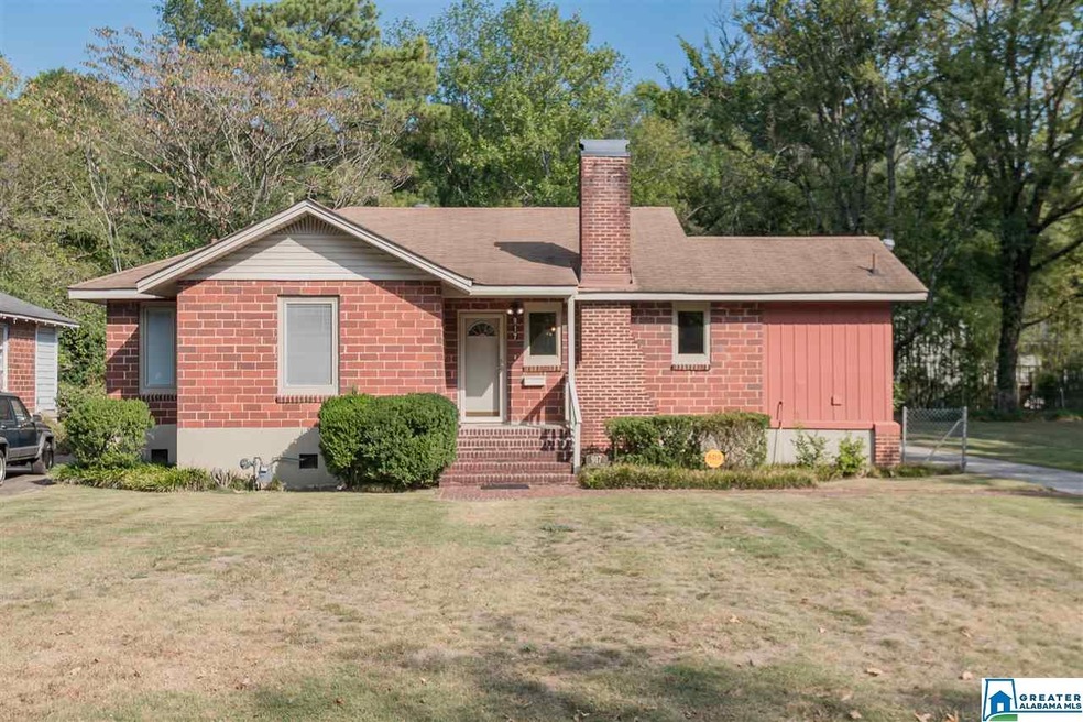 Cute, brick Homewood bungalow with a full, flat, v
