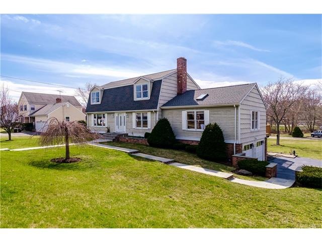 This Gambrel colonial aims to please, both inside 