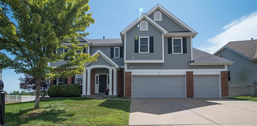 Newer Vinyl Siding with Brick elevation, covered f