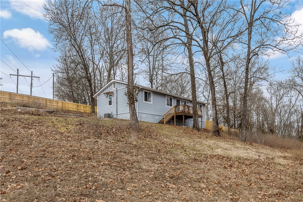 Nestled on 1.20 acres of wooded, secluded land wit
