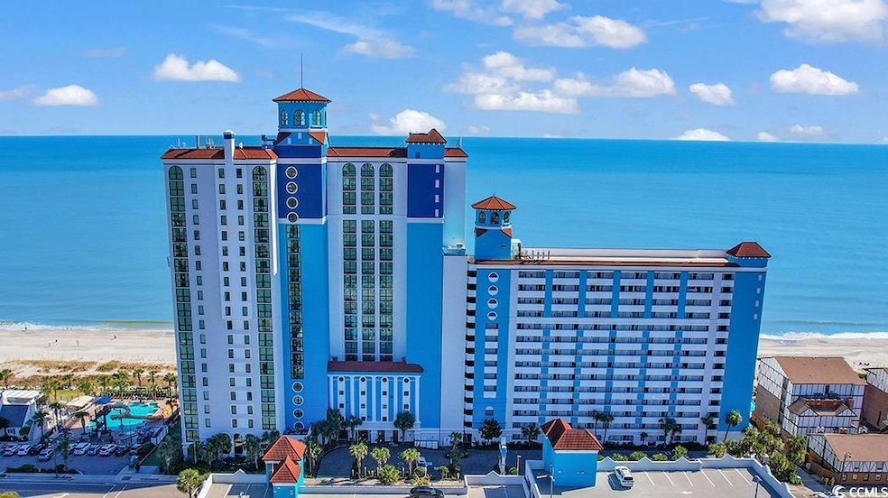 Aerial view with a water view and a beach view