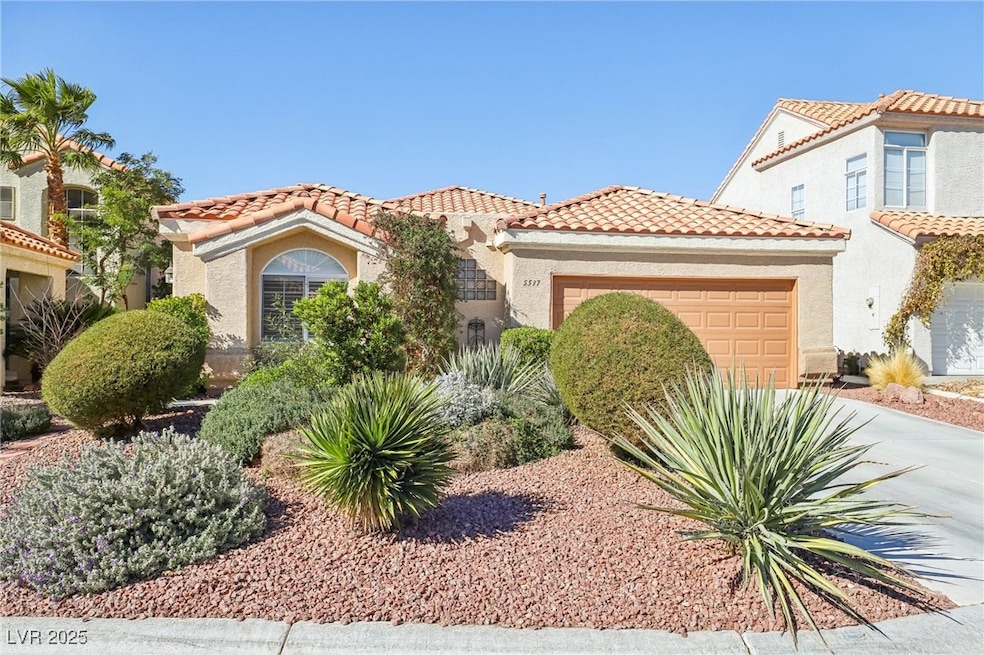 Mediterranean / spanish house featuring driveway,