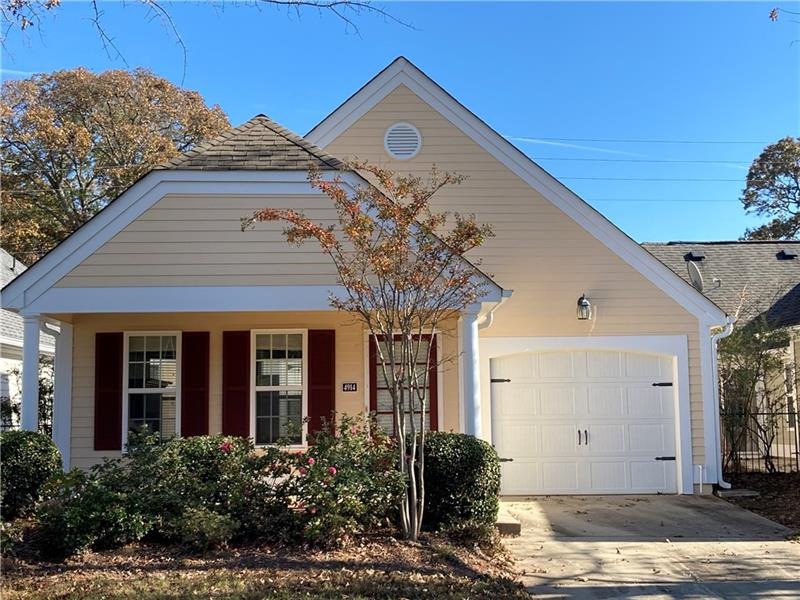 Charming, detached ranch home with a rocking chair