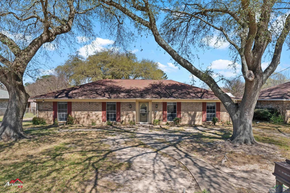 Ranch-style house featuring brick siding
