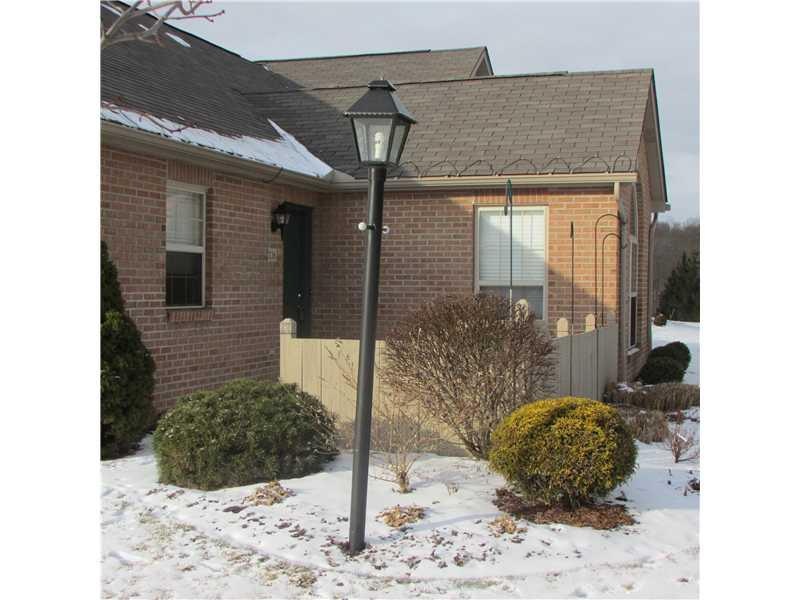 Exterior Front. PRIVATE ENTRANCE WITH ENCLOSED PATIO FACING WOODED AREA