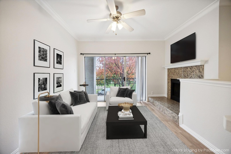 Living room with ceiling fan, light wood-type floo